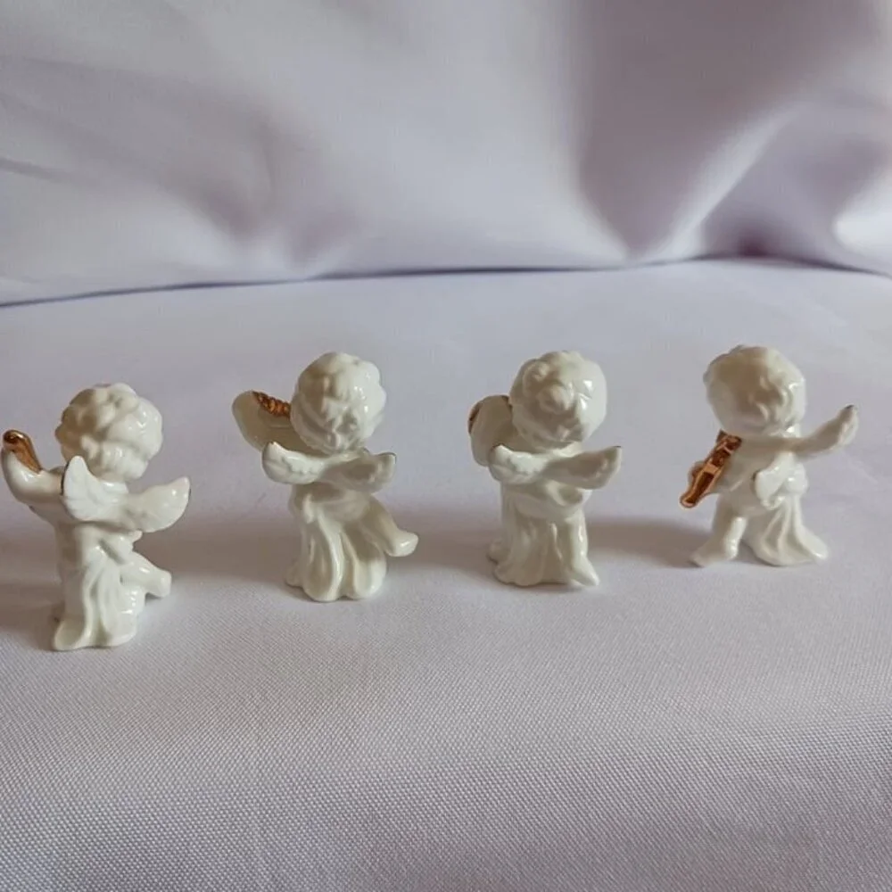 Bone china set of 4 angels gathered playing instruments